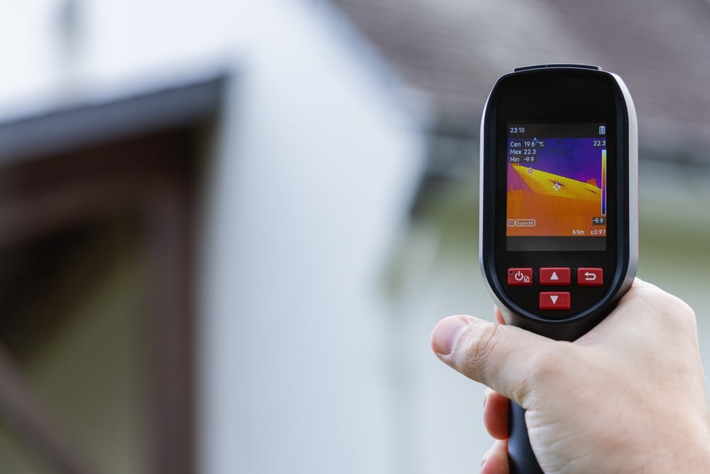 a,thermal,imaging,camera,performing,an,energy,audit,of,a